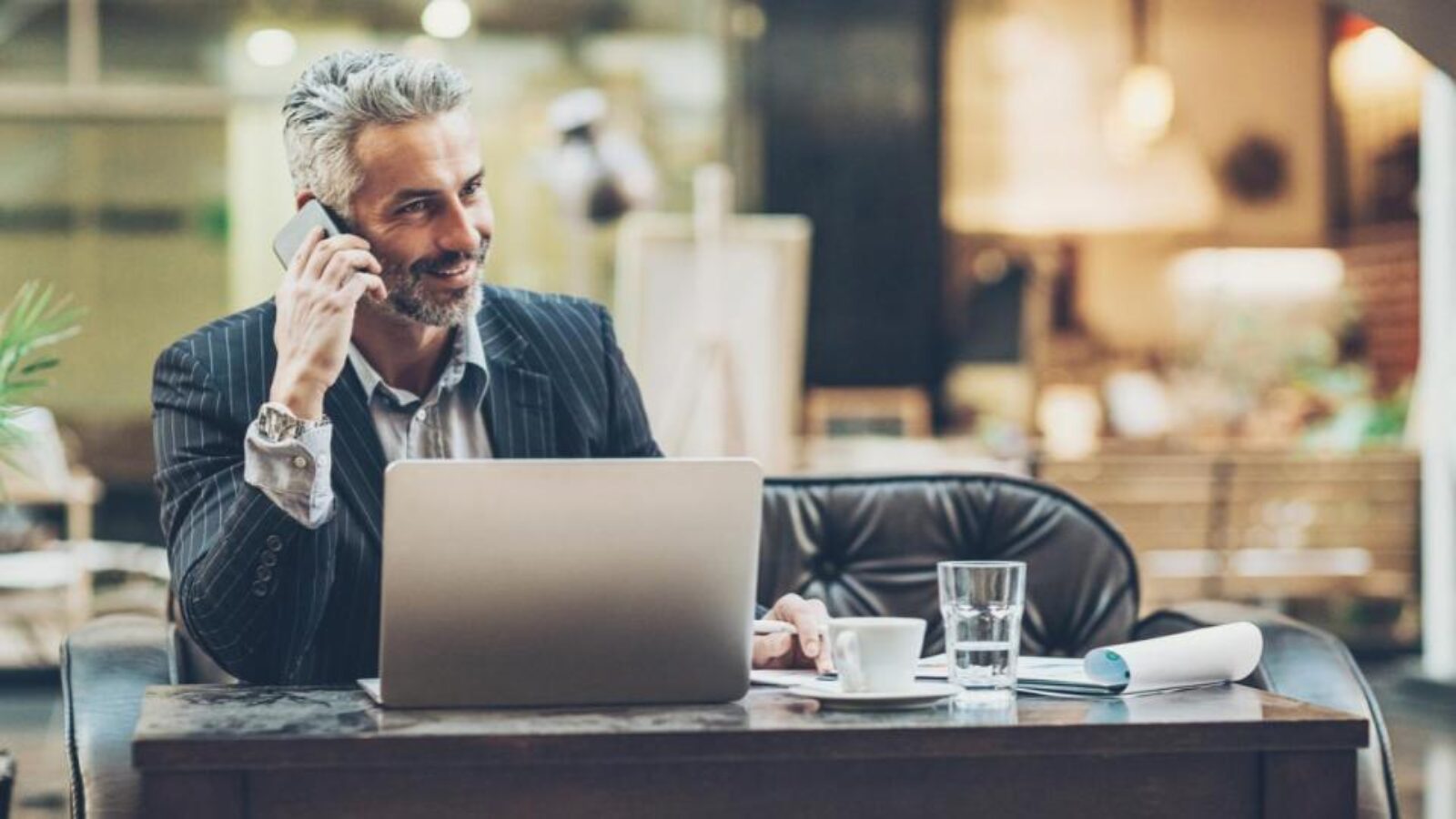 B2B salesperson making a call in a lobby