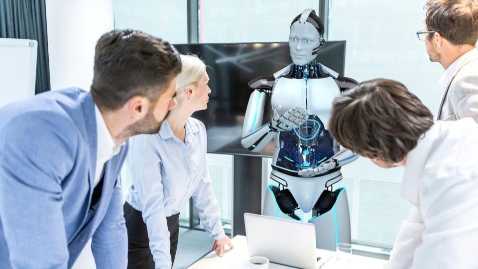 Business professionals consult with an AI android in a boardroom